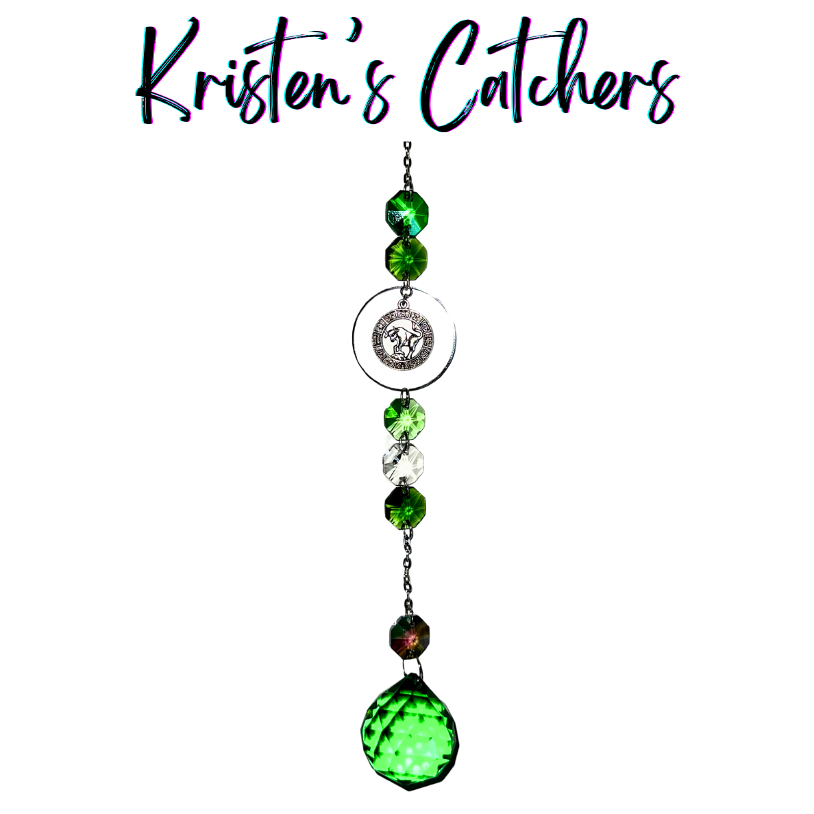 Silver Taurus sun catcher with emerald green crystal accents and clear prisms creating dancing light patterns