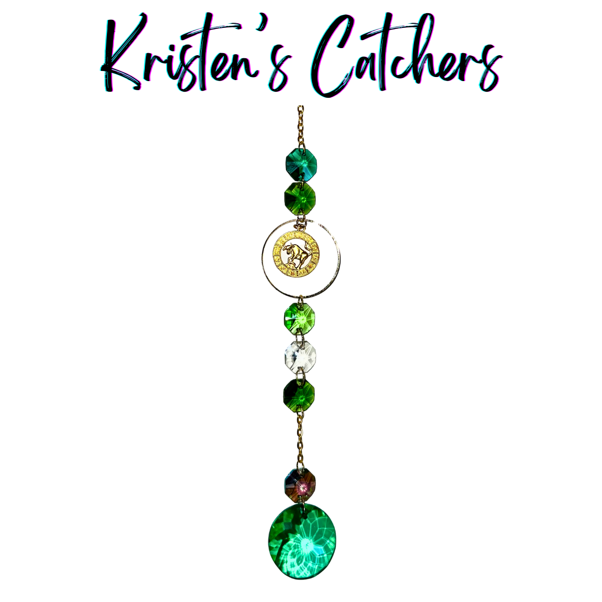 Gold Taurus sun catcher with emerald green crystal accents and clear prisms creating dancing light patterns