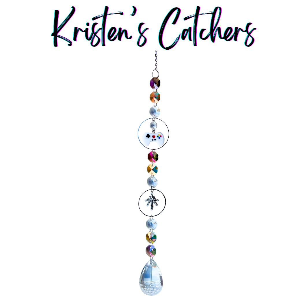 Handcrafted single strand sun catcher with white game controller charm, silver botanical leaf charm, iridescent oil-slick and opal beads, and a large clear A/B teardrop pendant drop
