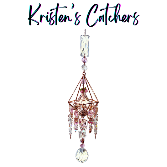 Handcrafted 3D rose gold geometric sun catcher with cascading pink and iridescent crystal fringe, butterfly and floral charms, rectangular header prism, and a large clear ball pendant drop