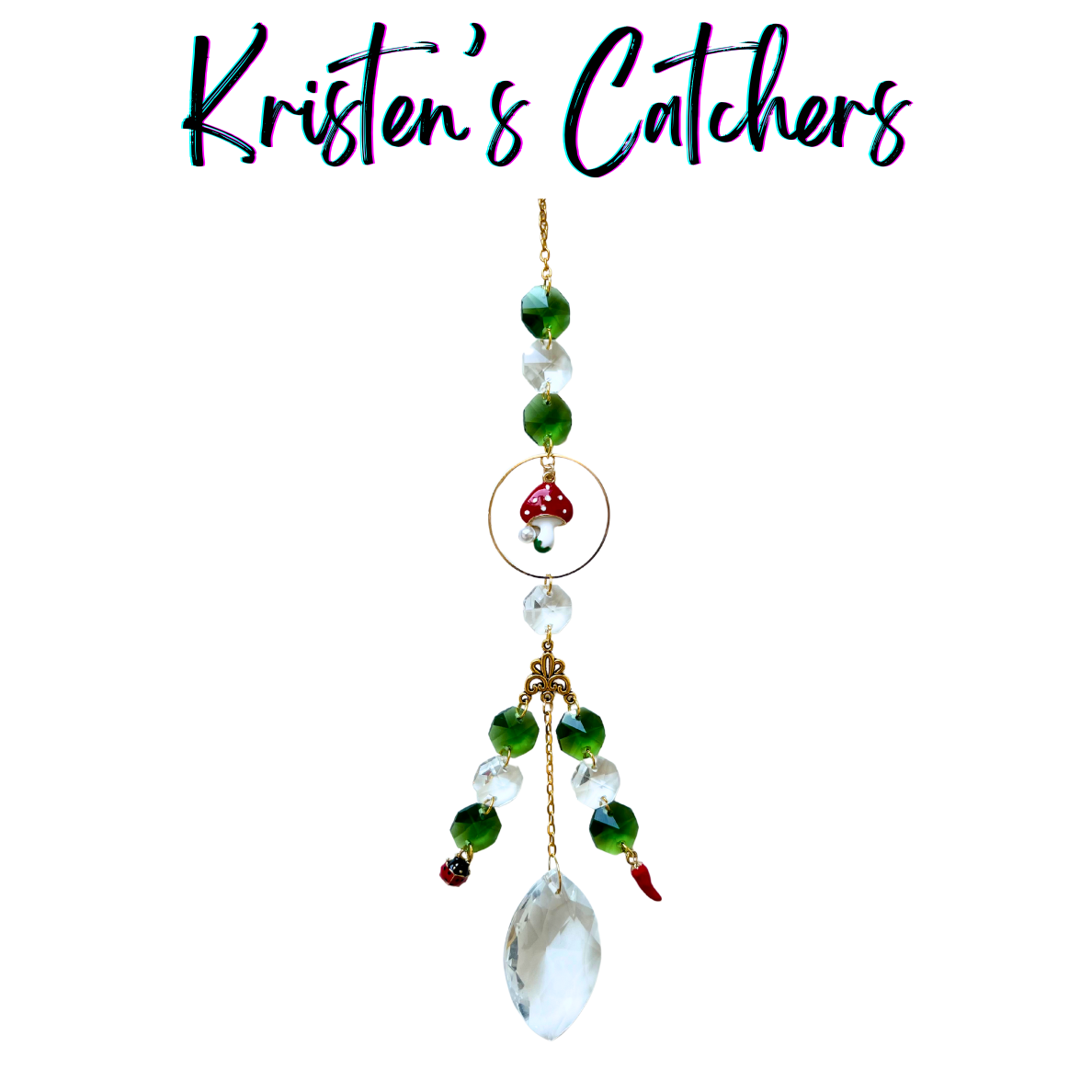 Woodland Spice Sun Catcher with red mushroom charm, chili pepper, ladybug accents, green and crystal prisms, and marquise crystal pendant hanging against white background