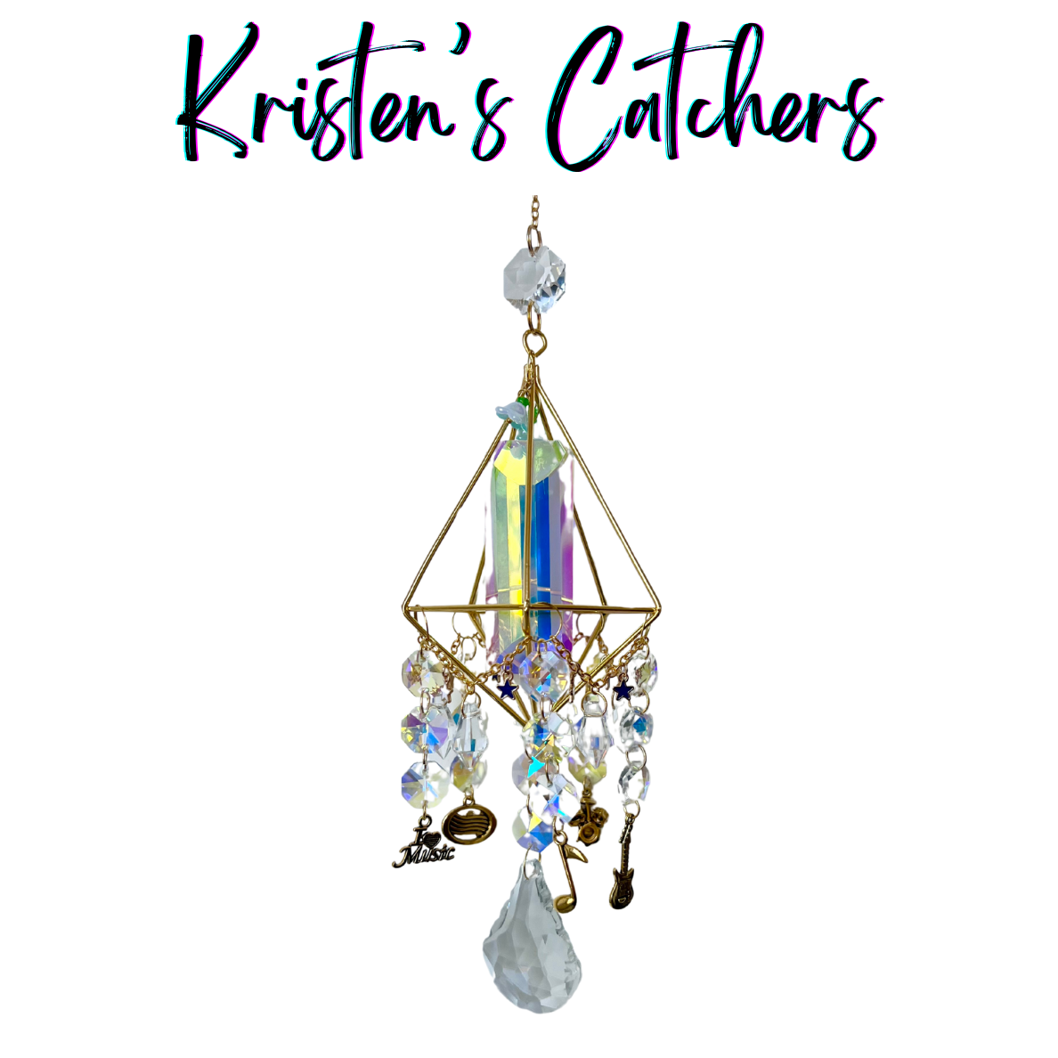 Musical Symphony 3D Geometric Sun Catcher with gold pyramid frame, musical instrument charms, star accents, and crystal prisms hanging against white background