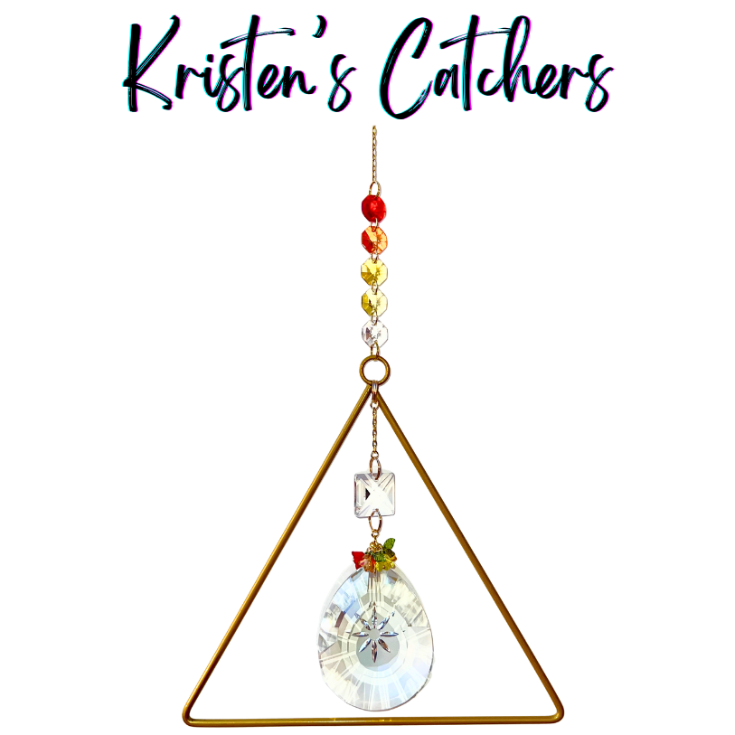 Handcrafted experimental sun catcher with large gold triangle frame, sunburst-etched oval crystal pendant, flame gradient bead header, and square lattice crystal connector.