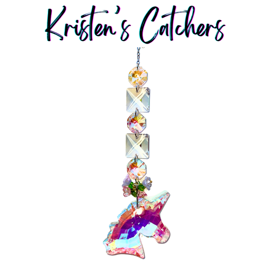 Handcrafted single strand sun catcher with large chunky A/B iridescent unicorn crystal pendant, flower charm cluster, alternating square and round crystal connectors, and champagne bead topper.