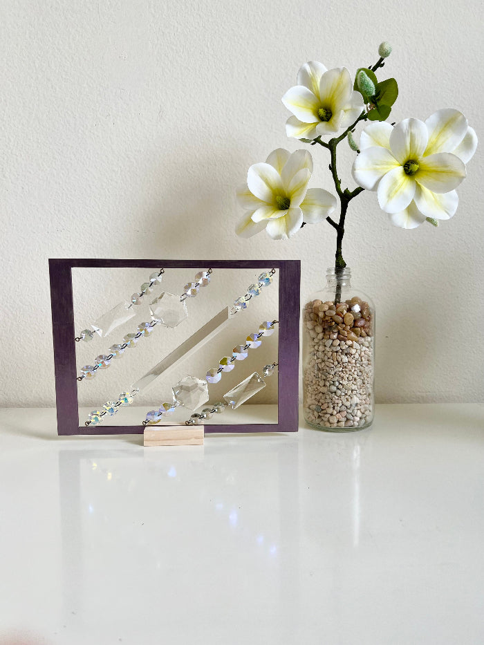 Shifting Aurora desk sun catcher alternate angle showing crystal fringe and geometric frame Las Vegas