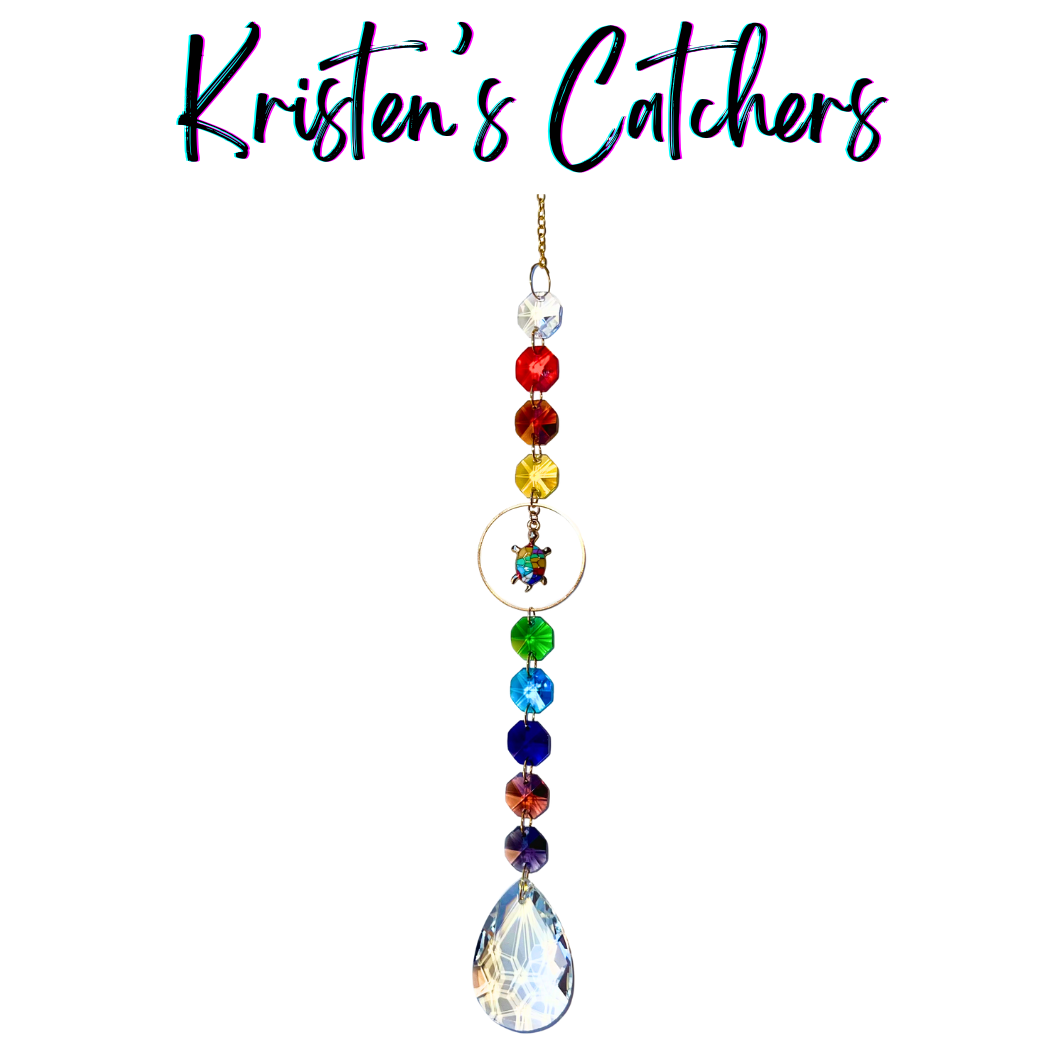 Hawaiian rainbow turtle sun catcher with honu charm featuring full spectrum rainbow crystals from red to purple with teardrop prism