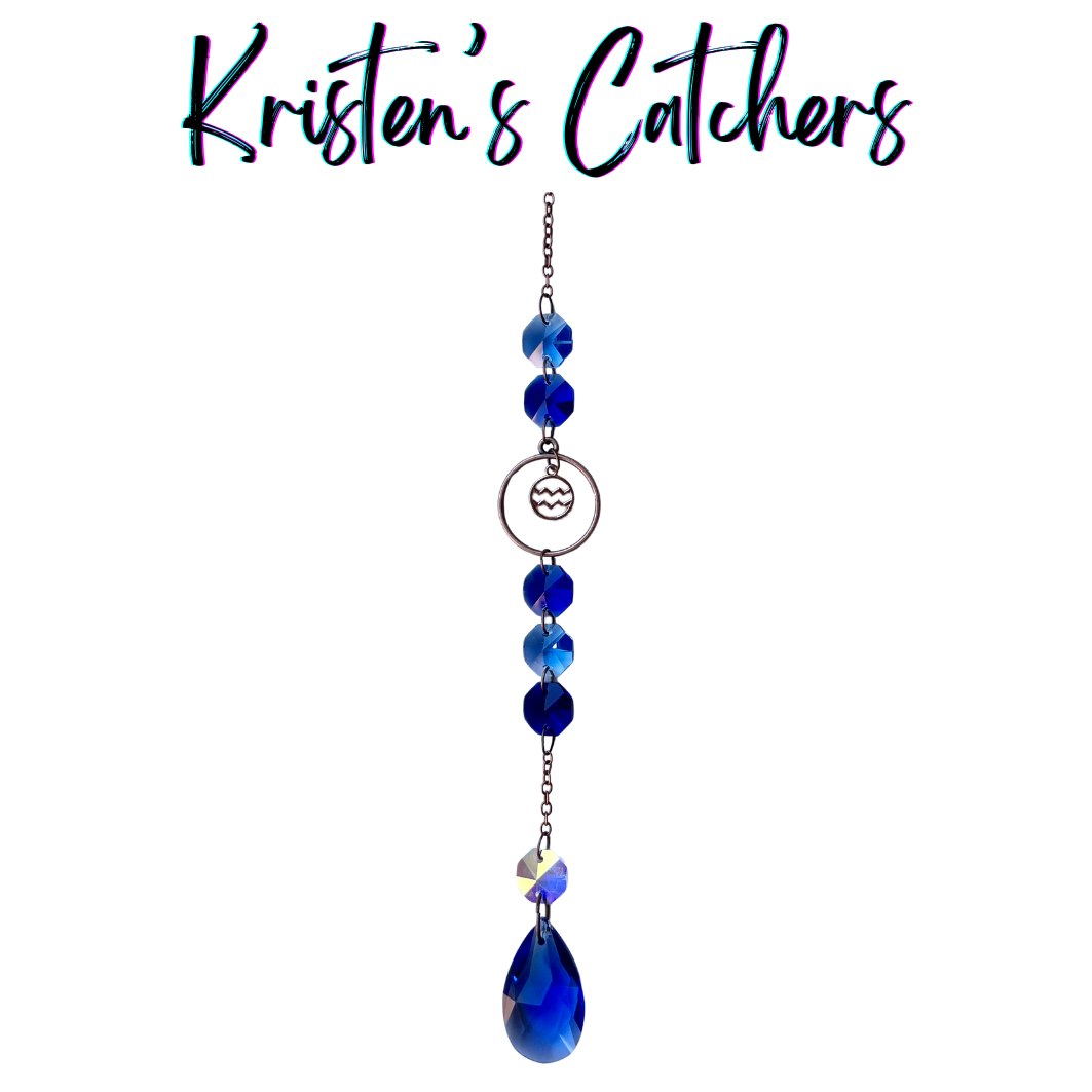 Aquarius zodiac sun catcher with water bearer symbol centerpiece featuring electric blue crystals with rose gold hardware