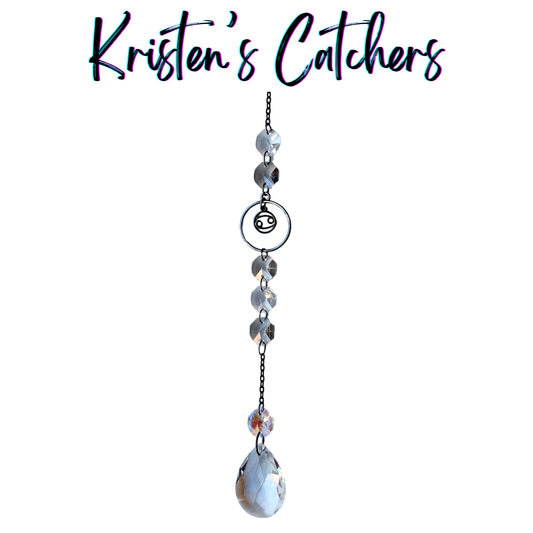 Cancer zodiac sun catcher with gunmetal crab symbol centerpiece featuring blue and gray crystals with black chain