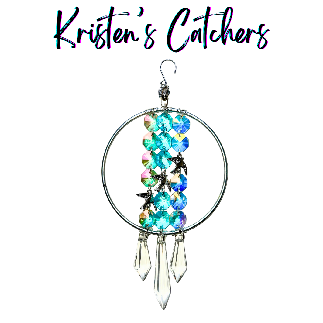 Ornamental sun catcher with ascending silver birds and aqua aurora borealis accents