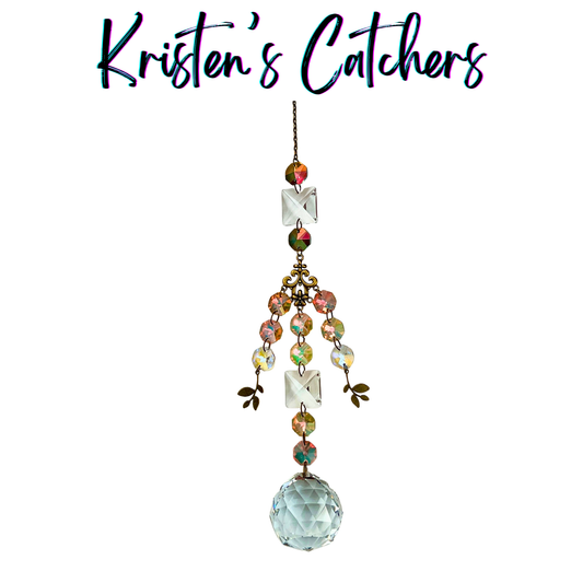 Secret garden bronze sun catcher with bronze leaf charms, scrollwork connector, A/B color-shifting crystals and large faceted ball prism