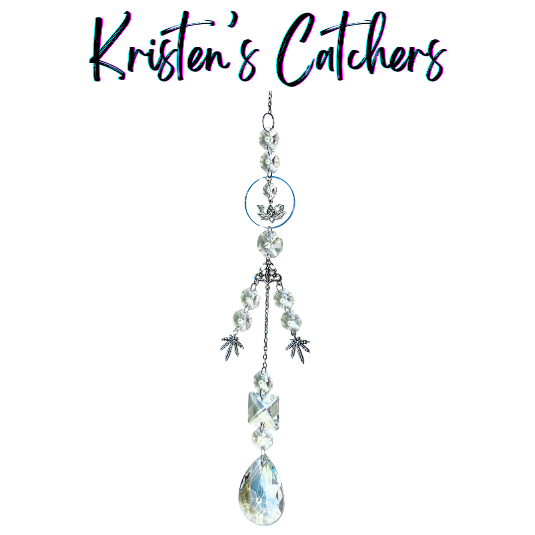 Handcrafted single strand sun catcher with silver lotus charm, om symbol connector, three silver botanical leaf charms, clear faceted beads, stacked clear crystals, and a large A/B teardrop pendant drop