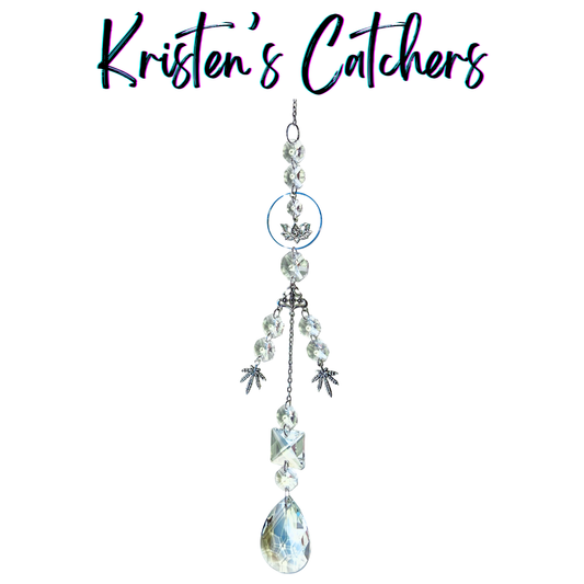 Handcrafted single strand sun catcher with silver lotus charm, om symbol connector, three silver botanical leaf charms, clear faceted beads, stacked clear crystals, and a large A/B teardrop pendant drop