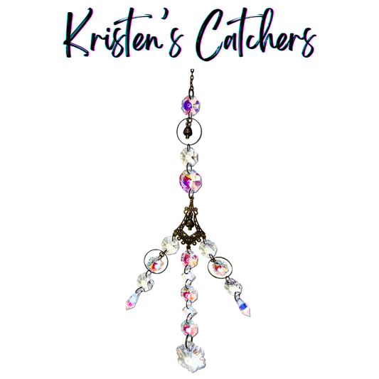 Handcrafted bronze multi-strand sun catcher with mini mushroom charms, ornate filigree connector, iridescent A/B crystals, spear drops, and a snowflake crystal pendant.