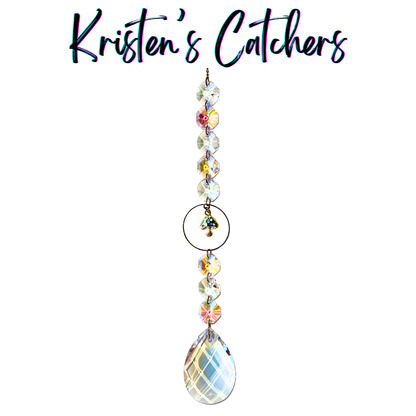 Handcrafted single strand sun catcher with gold teal-spotted mushroom charm, bronze ring connector, iridescent A/B beads, and a large lattice-cut teardrop pendant drop.