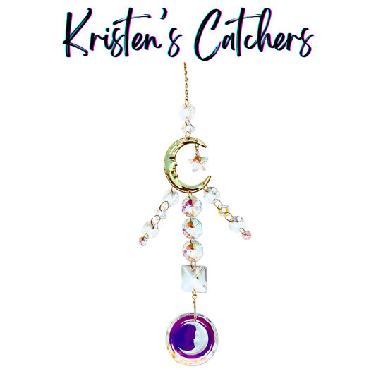Handcrafted Artemis-inspired sun catcher with gold crescent moon connector, star charm, iridescent A/B crystal fringe, and a purple moon face circle pendant drop.