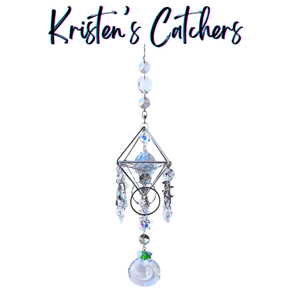 Handcrafted Artemis II-inspired 3D silver geometric sun catcher with four crescent moon charms, astronaut figure, clear spear crystal drops, and a moon-shaped opalescent pendant drop.