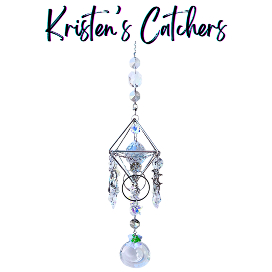 Handcrafted Artemis II-inspired 3D silver geometric sun catcher with four crescent moon charms, astronaut figure, clear spear crystal drops, and a moon-shaped opalescent pendant drop.