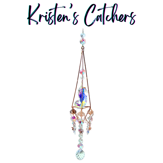 Oceanic Starfish Triangle Sun Catcher with rose gold triangular frame, seahorse centerpiece, and starfish charms creating marine-themed light art