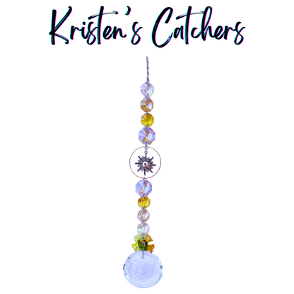 Golden Sunburst Tribute Sun Catcher with sunburst charm centerpiece and warm yellow-amber crystal cascade ending in textured crystal