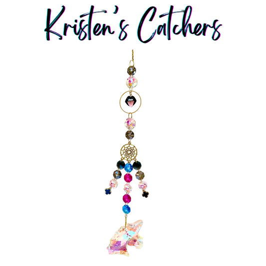 Whimsical Gothic Unicorn Sun Catcher with large black unicorn charm, gold dreamcatcher element, and multi-strand dark crystal cascade