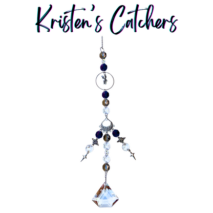 Cosmic Astronaut Voyage Sun Catcher with silver astronaut charm centerpiece and deep blue-silver crystal cascade ending in geometric prism