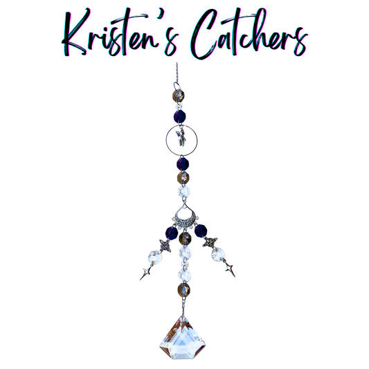 Cosmic Astronaut Voyage Sun Catcher with silver astronaut charm centerpiece and deep blue-silver crystal cascade ending in geometric prism