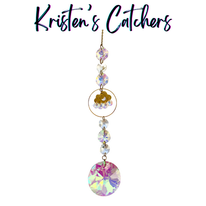 Whimsical crystal sun catcher with cloud and rainbow design