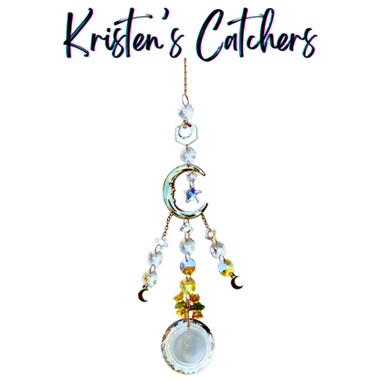 Celestial moon multi-strand sun catcher with crescent moon centerpiece, cascading prisms, and moon charms hanging against white background