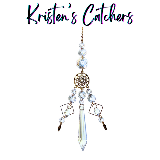 Classic dreamcatcher sun catcher with intricate web centerpiece, clear octagonal and icicle prisms, and feather accents hanging against white background