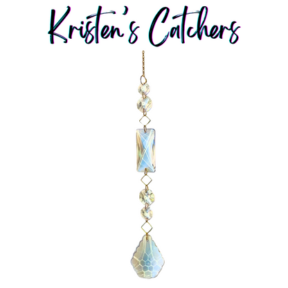Classic single strand sun catcher with gold square frame connectors, clear octagonal prisms, and large teardrop centerpiece hanging against white background