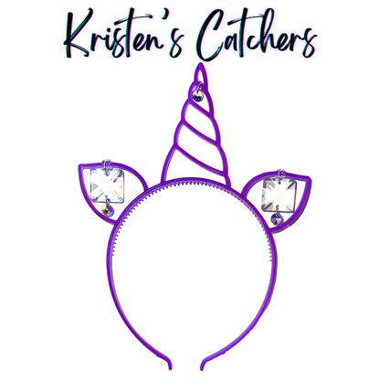 Neon purple glow-in-the-dark unicorn headband sun catcher with spiral crystal-topped horn, two ears, clear square crystal prisms, and yellow iridescent A/B accent crystals