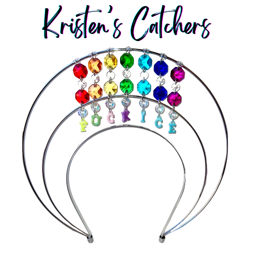 Double layer silver wire halo goddess crown hand-adorned with full rainbow octagon crystals across two arcs, clear rivoli accents, and rainbow letter charms spelling F*CK ICE