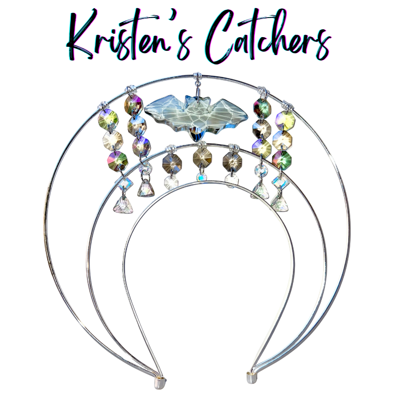 Double layer silver wire halo goddess crown hand-adorned with a clear bat shaped crystal centerpiece, shiny gray octagon crystals, iridescent A/B rivoli crystals, and clear soft triangle drops