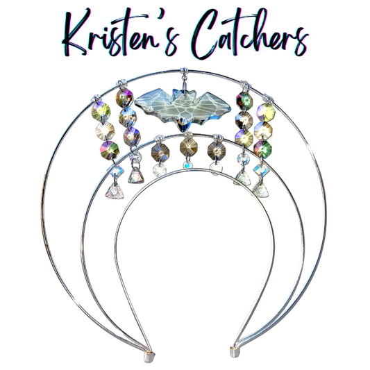 Double layer silver wire halo goddess crown hand-adorned with a clear bat shaped crystal centerpiece, shiny gray octagon crystals, iridescent A/B rivoli crystals, and clear soft triangle drops