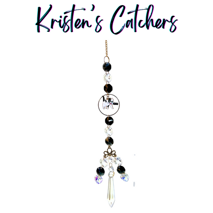 Cow Cat Tribute sun catcher with black and white cow cat centerpiece featuring black and clear crystals in elegant multi-strand design