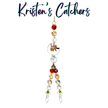 Orange Tabby Killer Cats sun catcher with orange tabby cat centerpiece featuring amber, red and clear crystals with green diamond accents