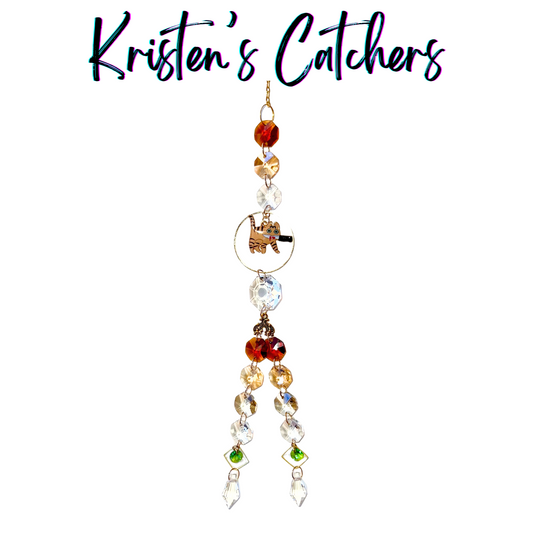 Orange Tabby Killer Cats sun catcher with orange tabby cat centerpiece featuring amber, red and clear crystals with green diamond accents