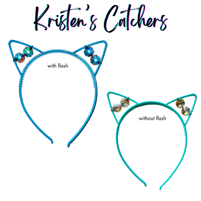 Iridescent faceted glass crystal cat ear headband on teal-blue frame shown with and without flash photography