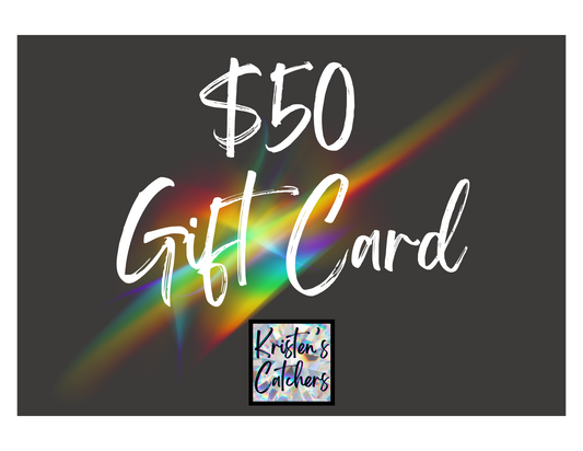 black gift card with rainbow splash and $50 value