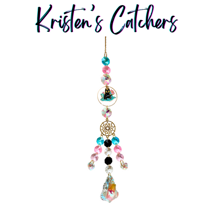 Dreamy Kitty Garden Sun Catcher with pink and blue crystals featuring a black cat charm amid flowers and a golden dreamcatcher-inspired design