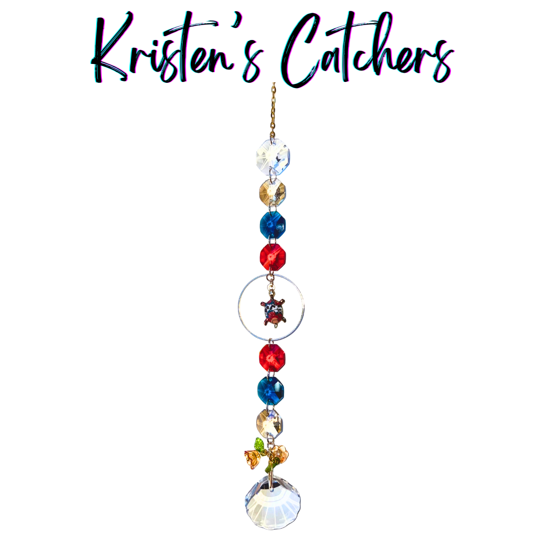 Hawaiian sea turtle sun catcher with honu charm featuring coral red, ocean blue and gold crystals with shell-shaped prism