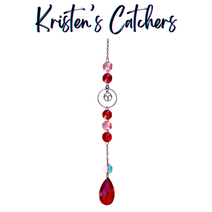 Aries zodiac sun catcher with ram symbol centerpiece featuring red and pink crystals with rose gold hardware