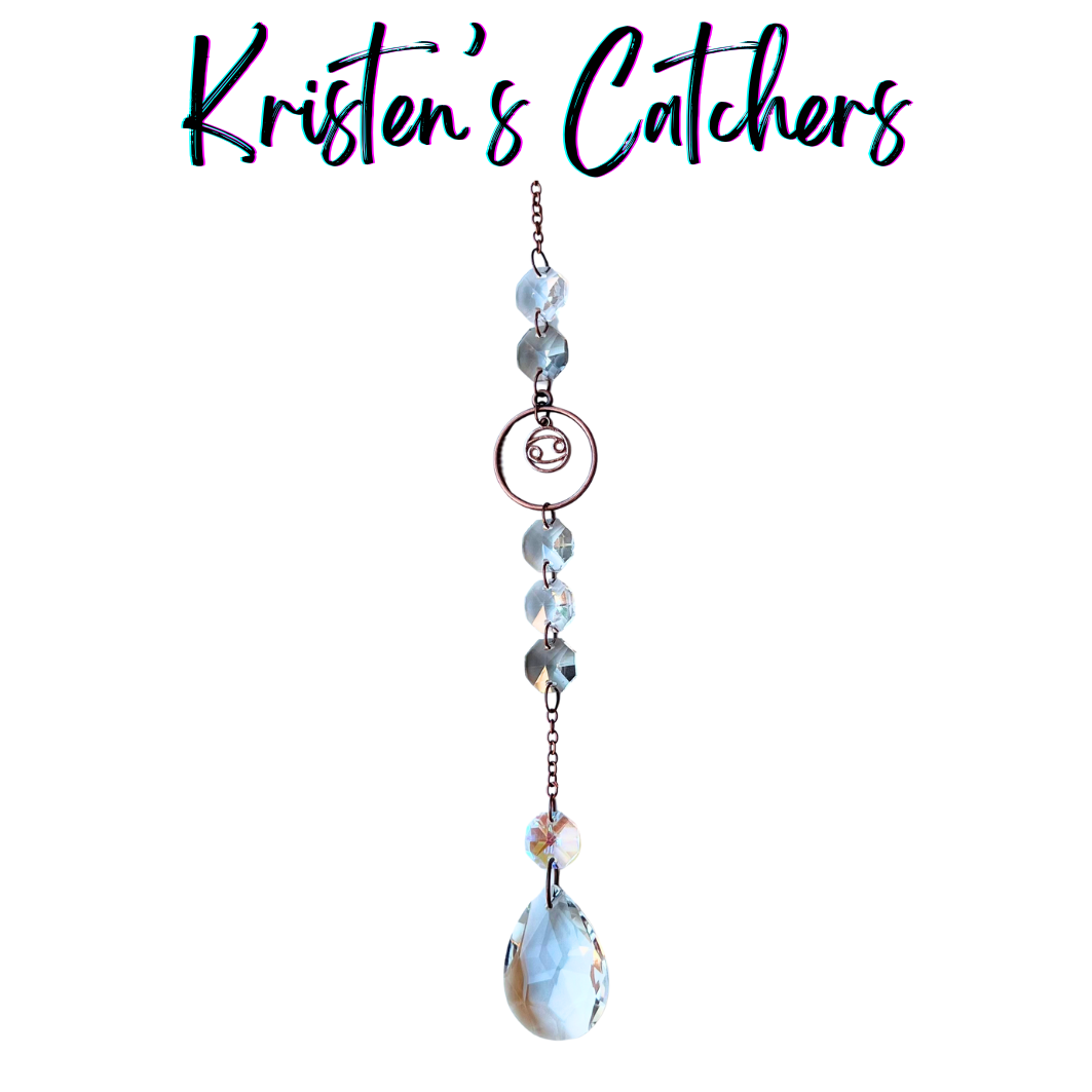 Cancer zodiac sun catcher with crab symbol centerpiece featuring blue and gray crystals with rose gold hardware