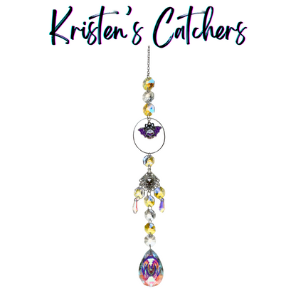 Batcat Skull Serenade Sun Catcher with iridescent crystals featuring a purple cat-bat hybrid charm and silver skull accent