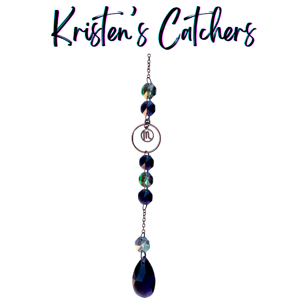 Scorpio zodiac sun catcher with scorpion symbol centerpiece featuring navy blue and teal crystals with rose gold hardware