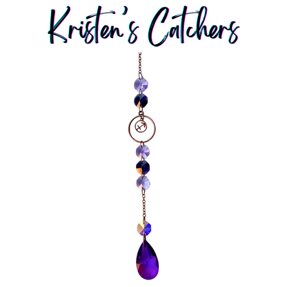 Sagittarius zodiac sun catcher with archer symbol centerpiece featuring purple crystals with rose gold hardware