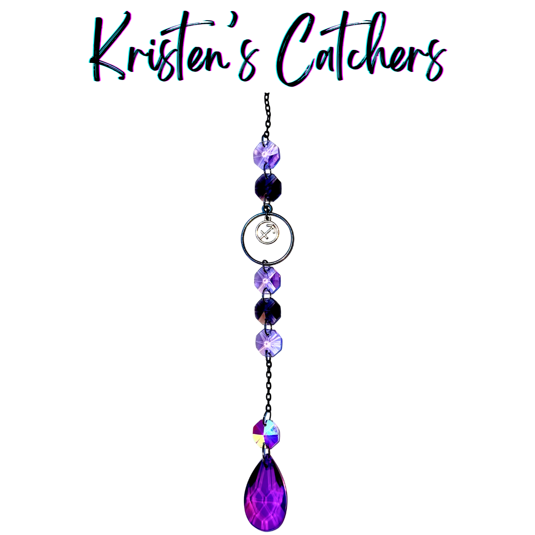 Sagittarius zodiac sun catcher with gunmetal archer symbol centerpiece featuring purple crystals with black chain