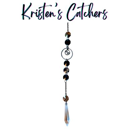 Capricorn zodiac sun catcher with gunmetal goat symbol centerpiece featuring smoky black and clear crystals with black chain