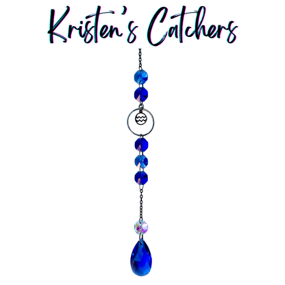 Aquarius zodiac sun catcher with gunmetal water bearer symbol centerpiece featuring electric blue crystals with black chain