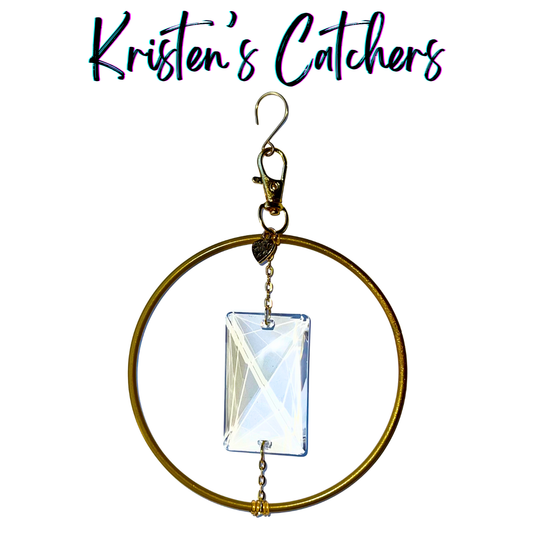 Minimalist elegance ornamental sun catcher with 4-inch golden ring suspending 3-inch rectangular prism via gold chain